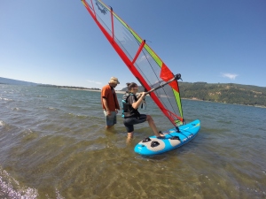 Teaching a less experienced windsurfing friend how to beach start. Jones Beach